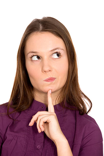 istock Woman with her finger on her chin thinking 160947970