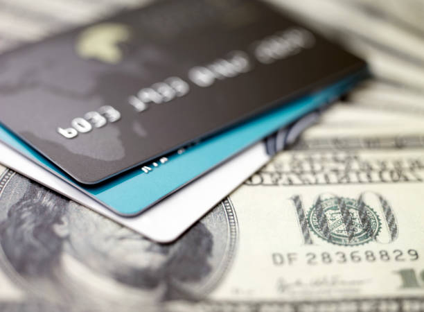 istock credit cards on dollars 160948525