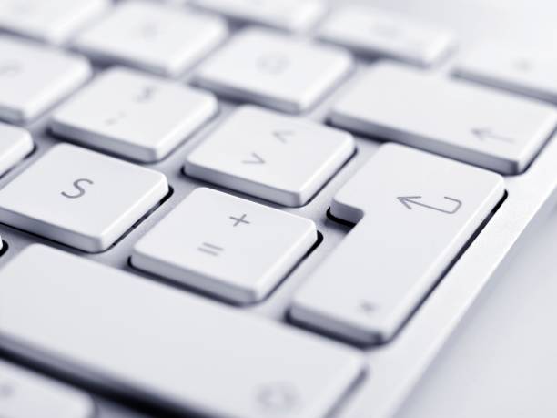 Close up of keyboard, focus on enter button close-up shoot of keyboard. enter key stock pictures, royalty-free photos & images