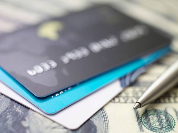 istock credit cards on dollars 160948682