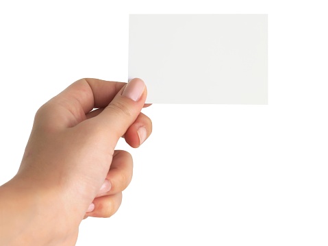 Hand holding an empty business card over white