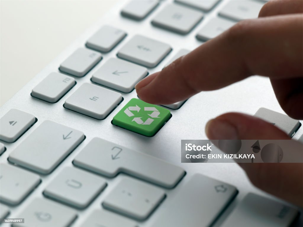 keyboard message,recycle young female hand pushing the recycle key. Biotechnology Stock Photo