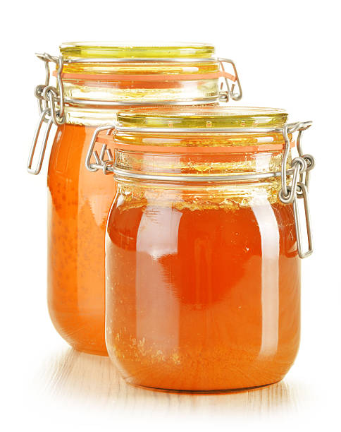 istock Two jars of honey isolated on white 160949143