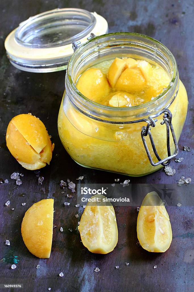 Preserved lemons in salt Preserved lemons in salt in the glass jar Citrus Fruit Stock Photo