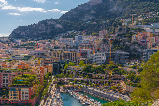 Summer landscape of Monaco. Aerial view. View of Skyline, Port de Fontvieille in Monaco, Monte Carlo. Many luxury yachts and mountains in the background.