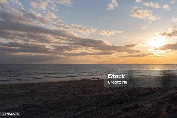 Sunset On The Sea Stock Photo - Download Image Now - Back Lit, Backgrounds, Beach