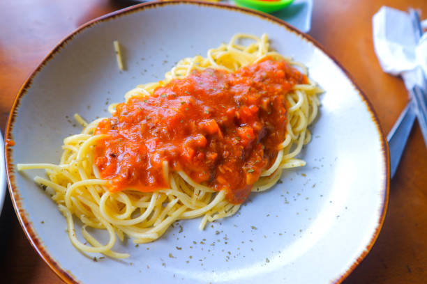 istock High angle view of spaghetti with tomato sauce on white plate 1609520915