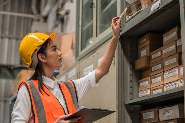 istock young engineer woman staff employee worker working in factory hardware warehouse store work check products count stock inventory parts lots list 1609534202