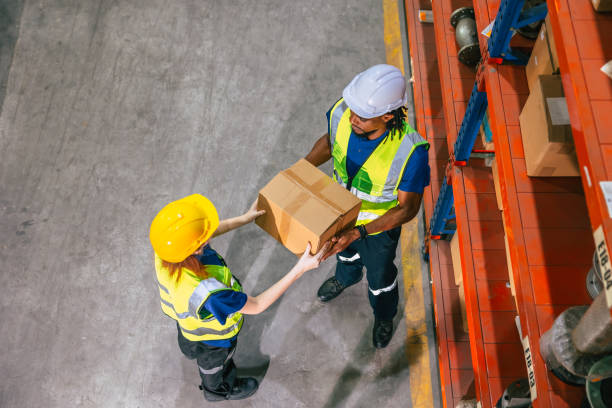 istock warehouse worker work in shipping logistics factory ship supply order goods cargo from store house 1609534787