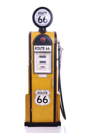 copy of a yellow vintage route 66 fuel pump isolated on white background