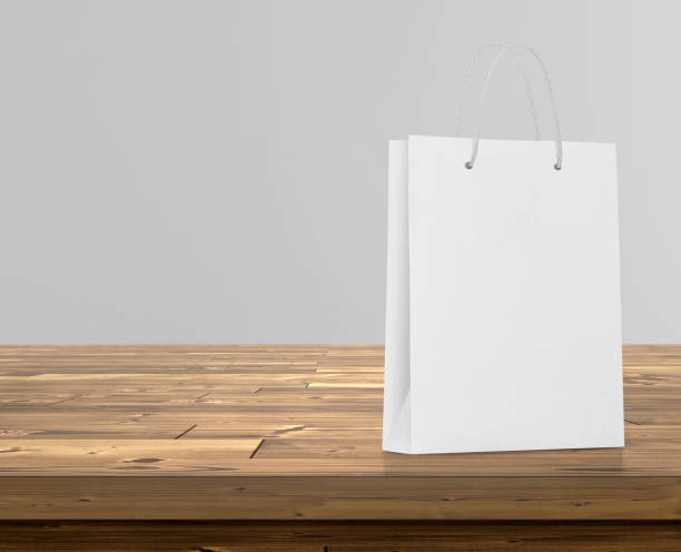 istock Empty shopping bags on wooden floor for advertising 1609564657
