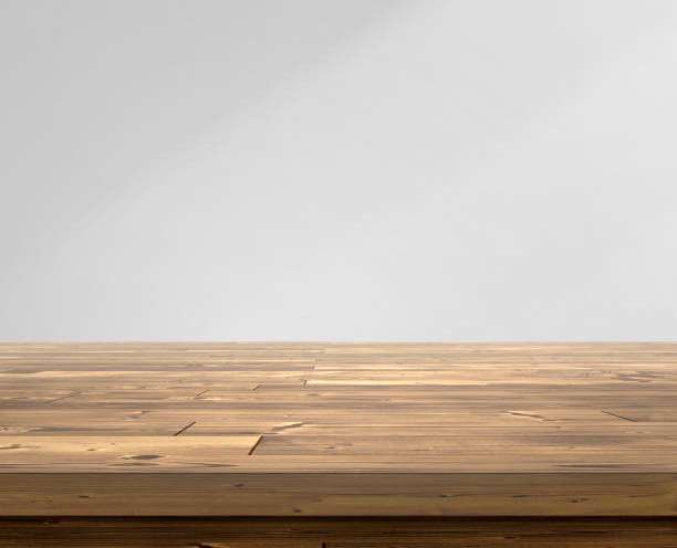 istock Wooden table top on room gray interiors background 1609565174