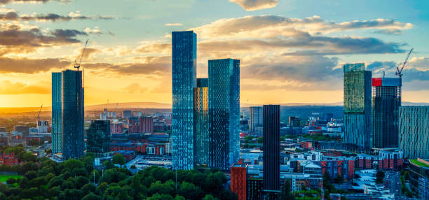 Manchester Skyline at Golden Hour Panoramic Aerial View of Manchester Skyline on a Beautiful Sunset Hour (Golden Hour) manchester england stock pictures, royalty-free photos & images