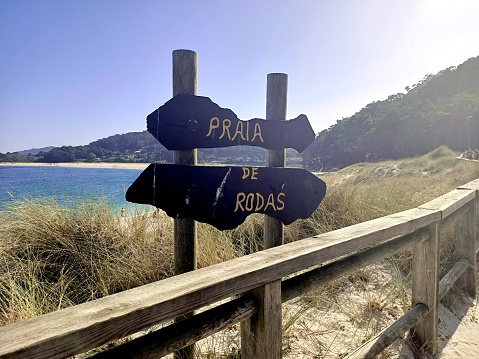 Views of the entrance sign to Rodas Beach on the Cíes Islands in the Ría de Vigo, belonging to the Rías Baixas in Galicia, Spain, in August 2023.