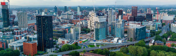 istock Manchester Skyline at Golden Hour 1609604282