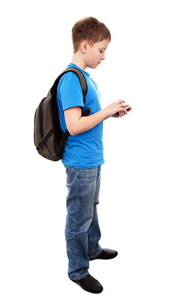 boy 濃縮テキストメッセージを送信します。 - text messaging mobile phone teenagers only people ストックフォトと画像