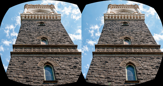Stone church tower from below in 3D.