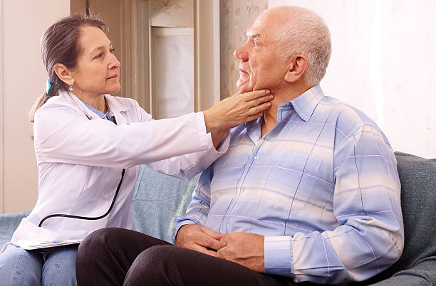istock mature doctor examining senior  patient 160968195