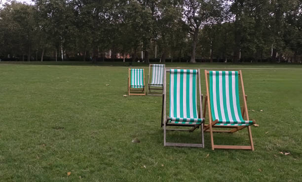 istock Deckchairs on the grass in St James's Park, London, UK 1609773238