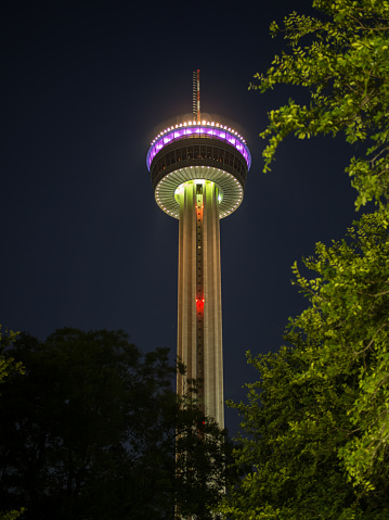 This spectacular photograph showcases the Tower of the Americas in San Antonio, Texas, at its most vibrant and captivating. Illuminated against the night sky, the tower's colorful lights dance and shimmer, creating a breathtaking display of modern architecture and technological innovation. As one of the tallest structures in Texas, the Tower of the Americas is an icon of the state's bold spirit and endless potential. The tower's observation deck offers stunning views of the city and its surroundings, making it a must-see destination for anyone visiting San Antonio. This photograph is a true masterpiece that captures the Tower of the Americas in all its glory and is sure to impress and inspire anyone who views it.