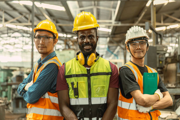 istock portrait three man engineer worker team standing arm crossed confident happy smile. group of industry people mix race. 1609782019