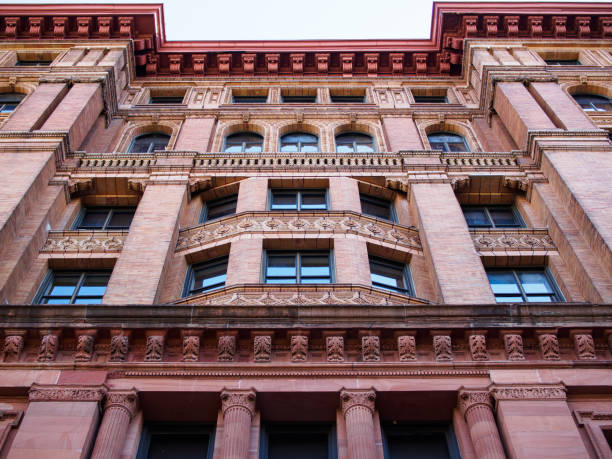 istock Philadelphia Bourse building seen from below in symmetrical perspective. 1609783696