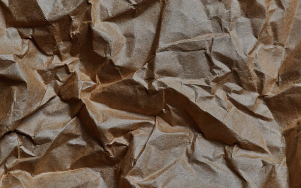 istock Background of the crumpled brown paper 1609814384