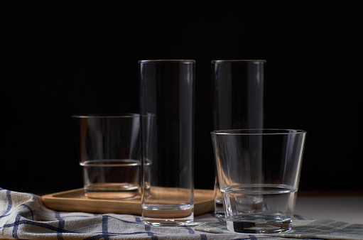 The empty drinking glass on black background