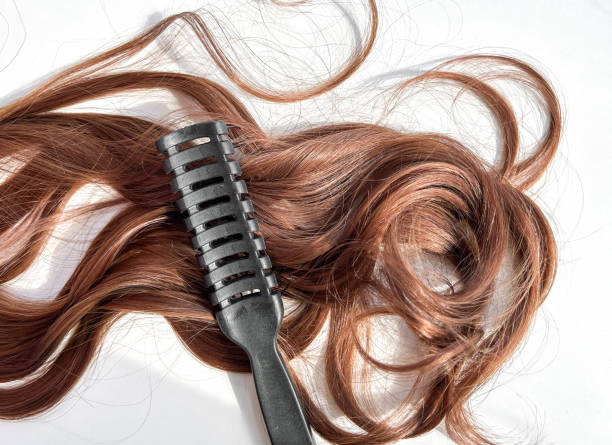 istock Hair extension dark, close-up on a white background, wig 1609816660