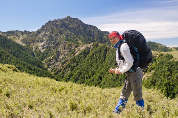 Happy mountaineering woman with backpacker in outdoor in Taroko National Park, Taiwan, Asia.