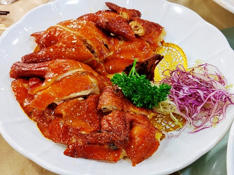 Closeup of asian caramel chicken wings, selective focus