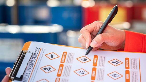 istock Checking on the chemical hazardous material form. Industrial safety working. 1609834311