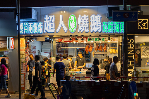 Hong Kong - August 12, 2023 : People buying dinner at the Chinese restaurant in Hung Hom, Kowloon, Hong Kong.