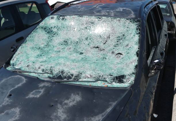 istock Car severely damaged by hailstorm. 1609837727