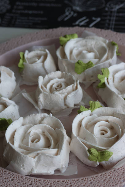 istock Homemade marshmallows. Zephyr flowers. On the tray. 1609843172