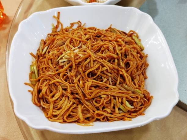 istock Braised e fu noodles with enoki mushroom in abalone sauce 1609852237