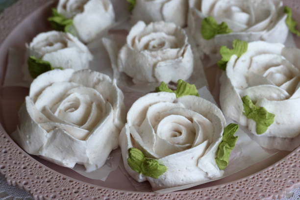 istock Homemade marshmallows. Zephyr flowers. On the tray. 1609854929