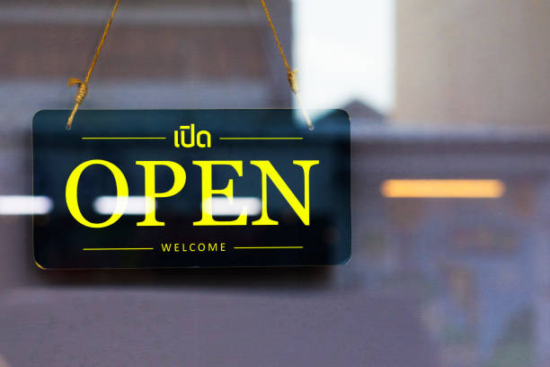 istock Yellow open and welcome sign 1609856550