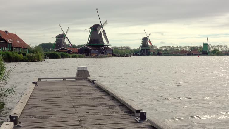 Dutch Windmills and a Wooden Jetty