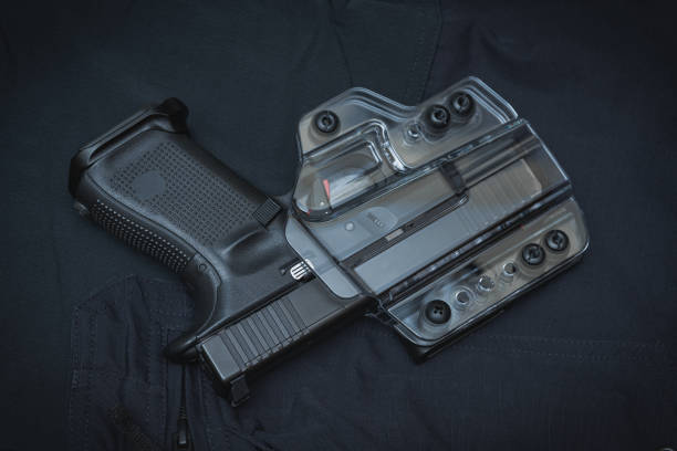 istock A pistol in a transparent holster on a black surface 1609862021