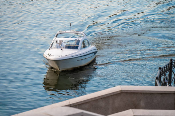 istock The small motorboat at the pier. 1609874684