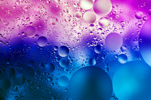 bright colorful abstract background, oil drops on the water surface , macro photography