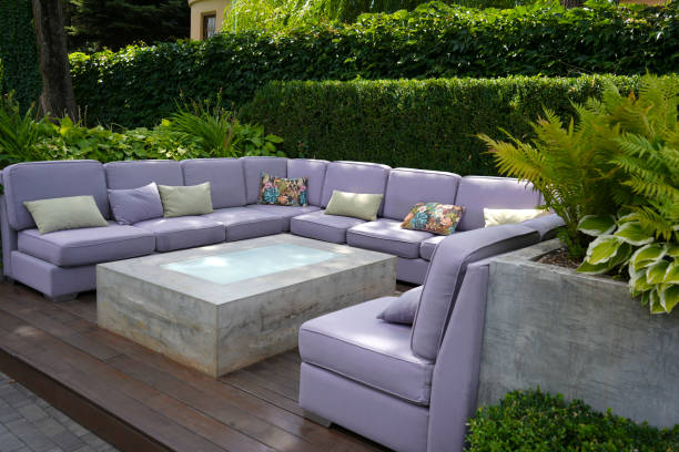 istock A large lilac sofa and a rectangular glass table in an outdoor cafe. 1609910130