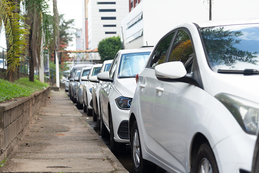 Salvador, Bahia, Brazil - August 11, 2023: Cars parked on a side street on Avenida Tancredo Neves. City of Salvador, Bahia.