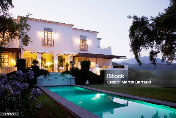 Luxury Lap Pool And Villa At Dusk Stock Photo - Download Image Now - Lap Pool, Swimming Pool, Villa
