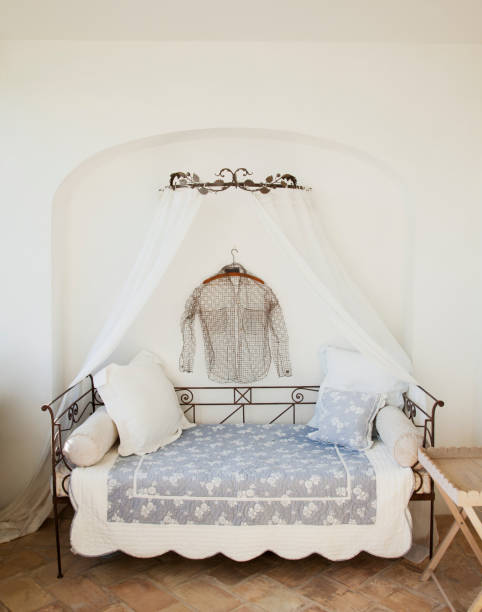 istock Shirt hanging over day bed with canopy on patio 160992196