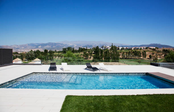 istock Lounge chairs and swimming pool 160992294