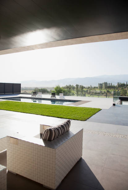 istock Luxury patio overlooking swimming pool 160992307