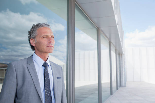 istock Pensive businessman outside building 160992585