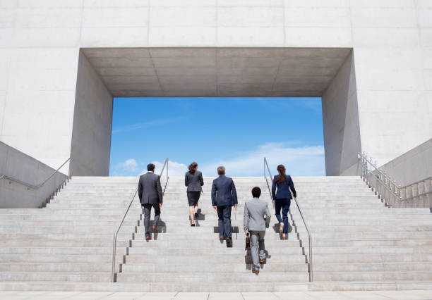 istock Business people ascending modern stairs 160993078